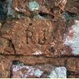 Initials carved by former gardeners into the walls at Cally.